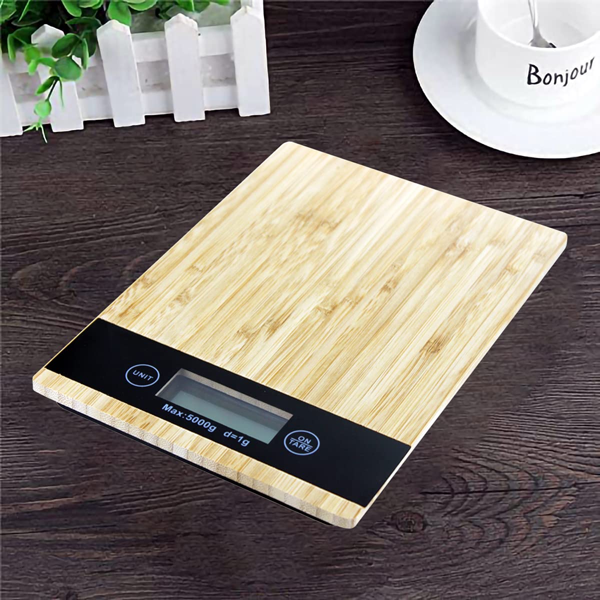 Taylor bamboo digital kitchen scale with 11 lb / 5 kg capacity, backlit LCD display, and tare function. Weighs dry and liquid ingredients in oz, g, fl oz, and ml. Eco-friendly bamboo platform.